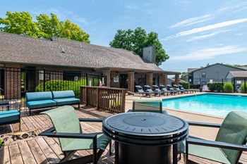 Table, chairs and couch by the pool